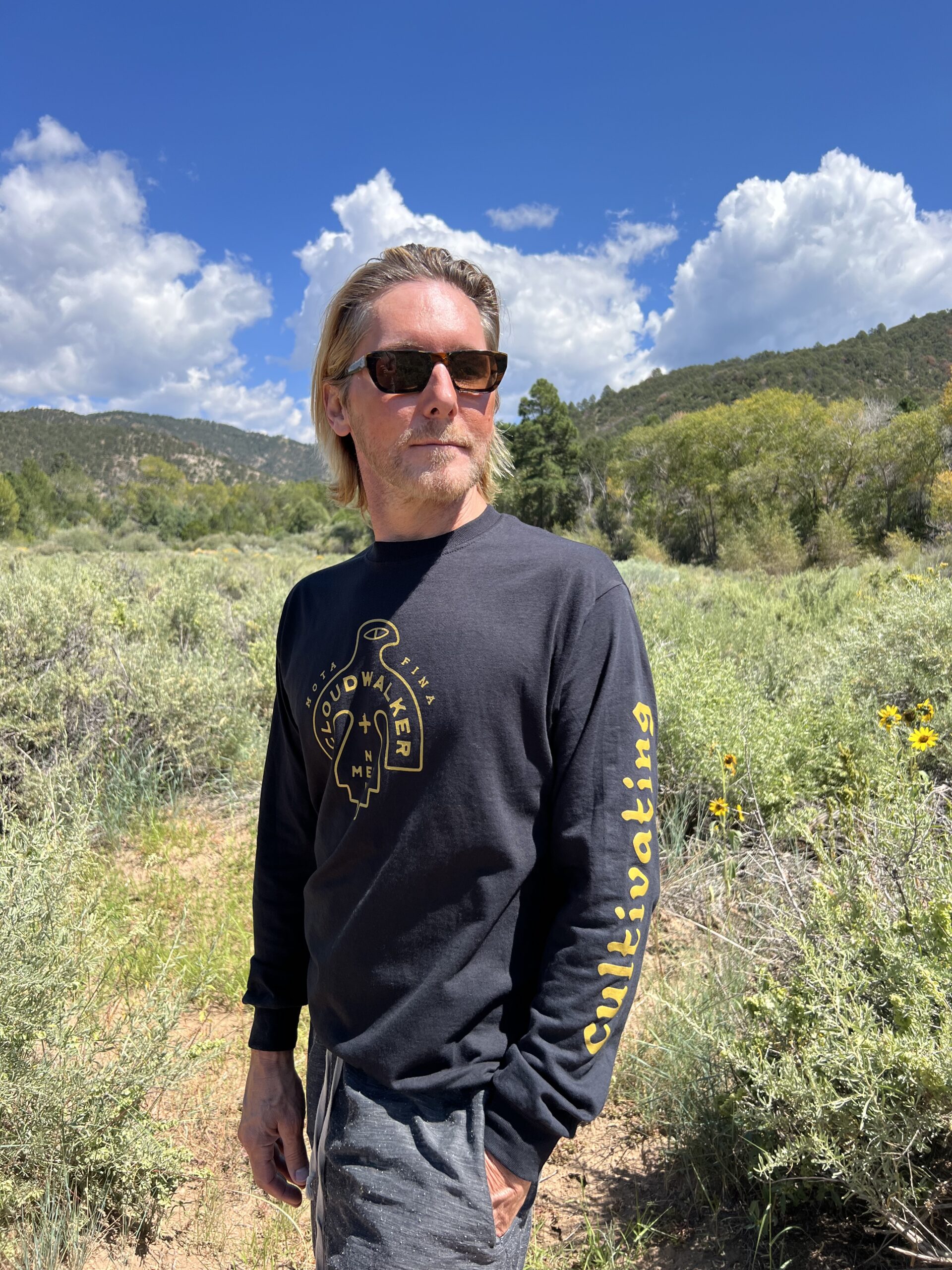 CloudWalker Farm 100% Cotton Long Sleeve T-Shirt "Cultivating Curiousity". Made in the USA. Model: CloudWalker Partner, Bradley Wade.